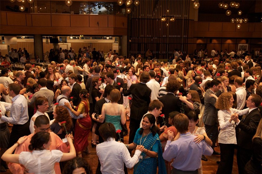 Young researchers dance during the festive part of the Meeting