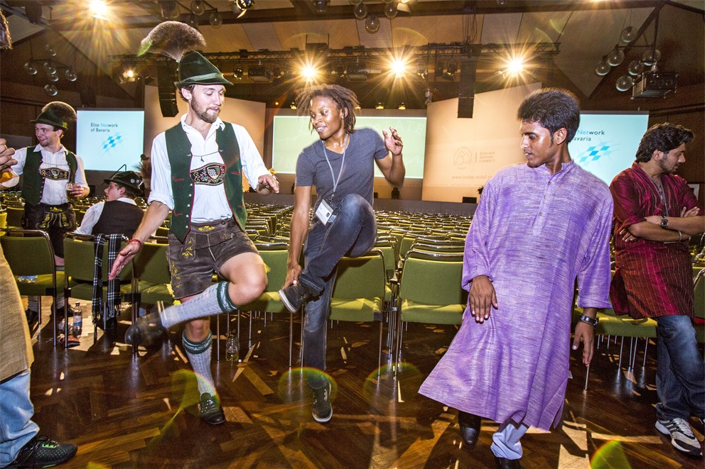 Young researchers dancing in their traditional attire at the Bavarian Evening.