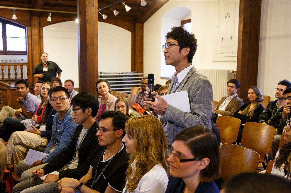Young researchers attending a discussion session.