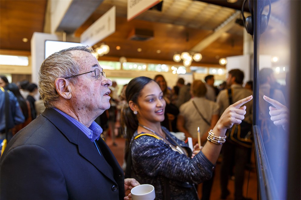 Arieh Warshel together with a young scientist at the 64th Meeting