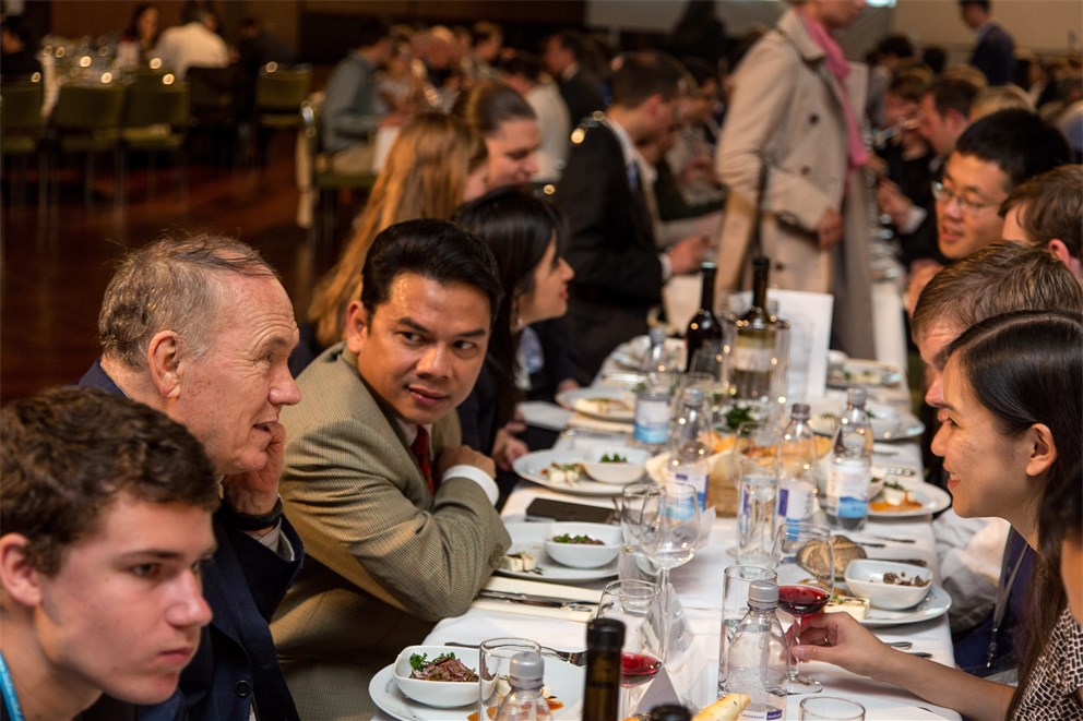 Edward C. Prescott conversing with young scientists at the get-together evening.