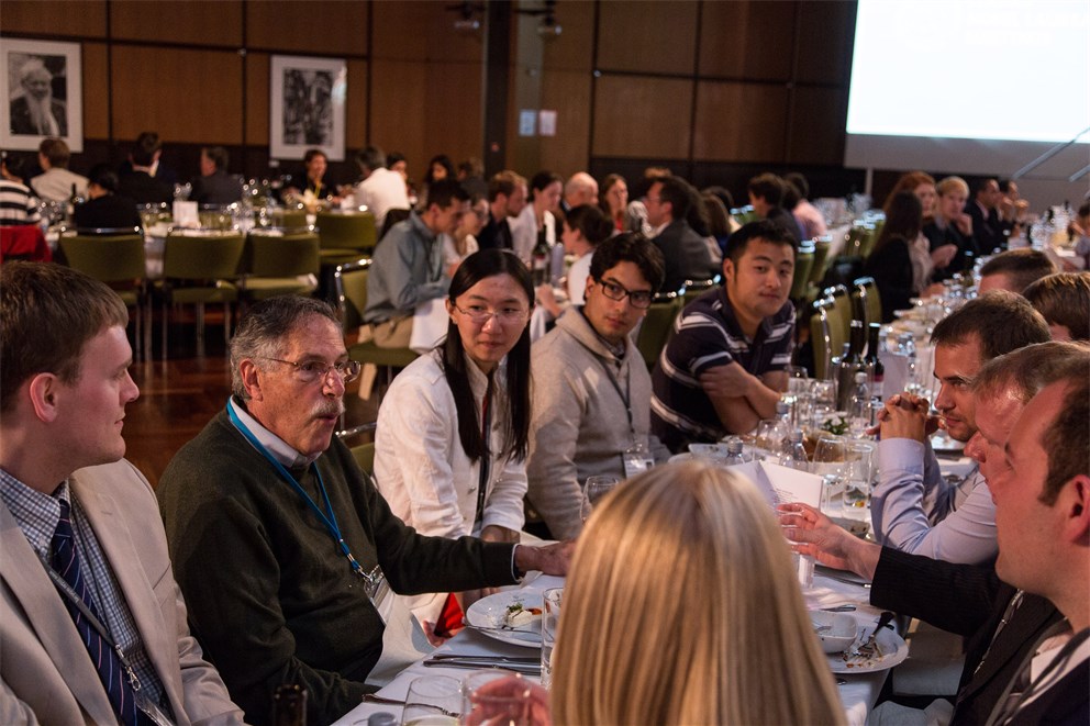 Peter A. Diamond together with young scientists at the get-together evening. 