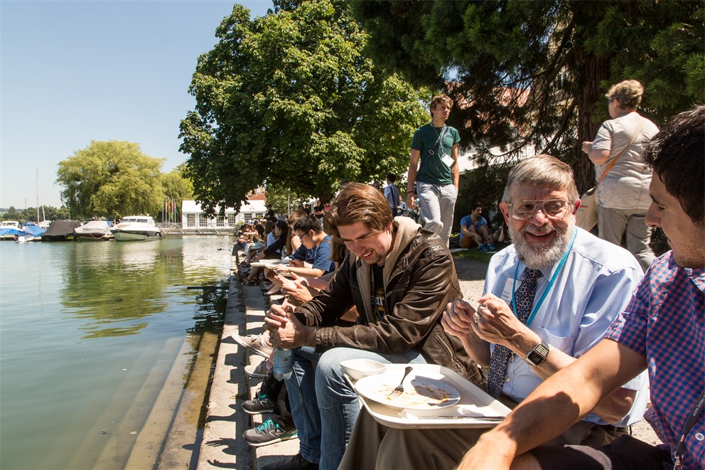 William Phillips having lunch with young scientists at the shores of Lake Constance.