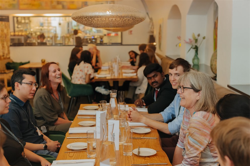 Donna Strickland in discussion with young scientists.
