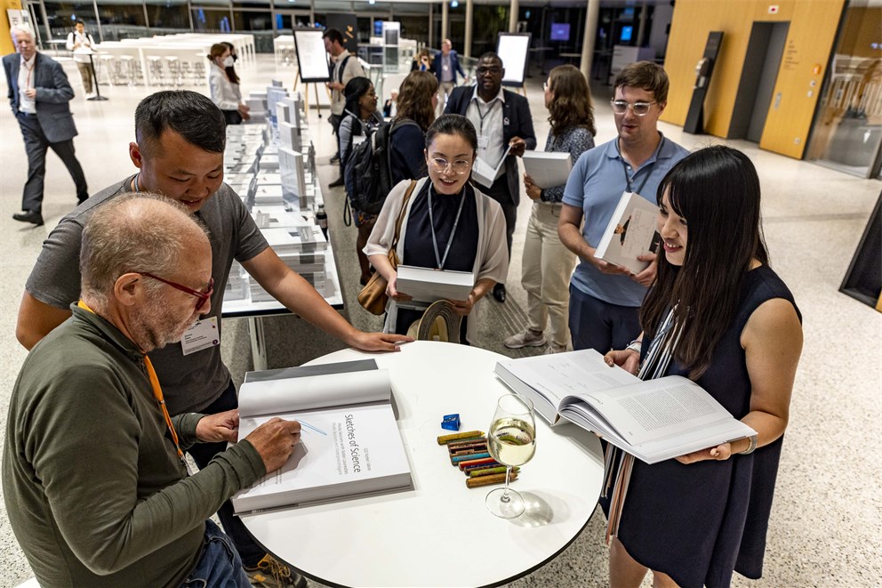 Volker Steger signing his book "Sketches of Science". 