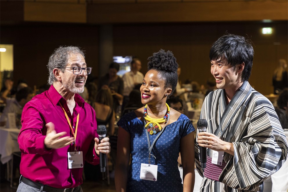Brian Malow interviewing Young Economists at the Bavarian Evening.